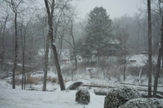 Snowy winter view of the bridge and pond